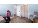 Home office with grey accent chair and stylish sliding closet doors at 1202 Lexington Ridge Ln, Apex, NC 27502