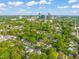 Expansive aerial view of the city skyline surrounded by lush greenery and neighborhood homes at 1202 S Bloodworth St, Raleigh, NC 27601