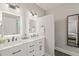 Bright bathroom featuring double vanity, white marble countertop and dual mirrors at 1202 S Bloodworth St, Raleigh, NC 27601