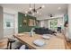 Open dining space featuring a modern light fixture and seamless flow to the living area at 1202 S Bloodworth St, Raleigh, NC 27601