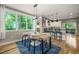 Dining area featuring a modern table, stylish chairs, and abundant natural light at 1202 S Bloodworth St, Raleigh, NC 27601