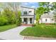 Charming modern home with a well-manicured lawn and inviting front porch at 1202 S Bloodworth St, Raleigh, NC 27601