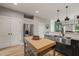 Bright kitchen featuring stainless steel appliances, granite countertops, and a butcher block island at 1202 S Bloodworth St, Raleigh, NC 27601