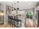 Bright, eat-in kitchen with a breakfast bar, pendant lighting, and stainless steel appliances at 1202 S Bloodworth St, Raleigh, NC 27601