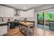 Well-equipped kitchen featuring white cabinets, stainless steel appliances, and a butcher block island at 1202 S Bloodworth St, Raleigh, NC 27601