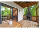 Covered porch featuring a fireplace, outdoor dining, and access to the kitchen through sliding doors at 1202 S Bloodworth St, Raleigh, NC 27601