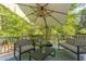 The deck has comfortable seating and table, perfect for relaxing with nature views at 1311 Antler Point Dr, Durham, NC 27713