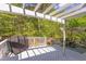 Wide shot of white deck and white pergola, next to lush foliage at 1311 Antler Point Dr, Durham, NC 27713