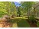 Picture of backyard showing foliage and nice grass at 1311 Antler Point Dr, Durham, NC 27713