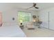 Upstairs bedroom has natural light, a ceiling fan, and a bonus desk area for school or work at 1311 Antler Point Dr, Durham, NC 27713