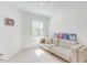 Small guest bedroom with a couch, lots of light, neutral walls, and cozy vibes at 1311 Antler Point Dr, Durham, NC 27713