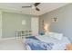 Bedroom showcasing plush bedding, a ceiling fan, and useful white storage furniture at 1311 Antler Point Dr, Durham, NC 27713