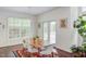 Cozy dining area featuring hardwood floors, stylish furnishings, and a view of the outdoors at 1311 Antler Point Dr, Durham, NC 27713
