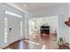 Inviting foyer with hardwood floors and views of the study at 1311 Antler Point Dr, Durham, NC 27713
