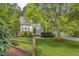 Charming two-story home with beautiful landscaping and a split rail fence at 1311 Antler Point Dr, Durham, NC 27713