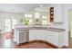 Bright kitchen with ample cabinet space, stainless steel appliances, and a view of the adjacent dining area at 1311 Antler Point Dr, Durham, NC 27713