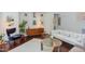 Well-lit living room with a large white sofa and colorful artwork at 1311 Antler Point Dr, Durham, NC 27713