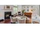 Bright living room featuring a fireplace, hardwood floors, and modern decor at 1311 Antler Point Dr, Durham, NC 27713