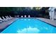 A sparkling blue swimming pool with lounge chairs for relaxation at 1311 Antler Point Dr, Durham, NC 27713