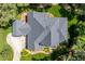 Aerial shot showcasing the home's roof and proximity to lush greenery, landscaping, and the driveway at 1317 Colonial Club Rd, Wake Forest, NC 27587