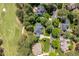 Aerial view showcasing the home's roof and proximity to lush greenery, landscaping, and the driveway at 1317 Colonial Club Rd, Wake Forest, NC 27587