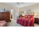 Comfortable bedroom with large window, cozy carpet, and stylish furniture at 1317 Colonial Club Rd, Wake Forest, NC 27587