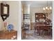 Elegant dining room with antique furniture, chandelier lighting, and hardwood floors at 1317 Colonial Club Rd, Wake Forest, NC 27587