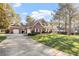 Spacious brick home with a large driveway and well manicured lawn at 1317 Colonial Club Rd, Wake Forest, NC 27587
