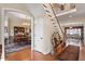 Grand foyer featuring hardwood floors, staircase, dining room and an inviting living space at 1317 Colonial Club Rd, Wake Forest, NC 27587