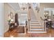 Bright foyer featuring a staircase and chandelier at 1317 Colonial Club Rd, Wake Forest, NC 27587