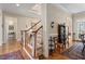 View of hallway with staircase and hardwood floors at 1317 Colonial Club Rd, Wake Forest, NC 27587