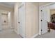 Hallway leads to multiple rooms and is painted in a light cream color at 1317 Colonial Club Rd, Wake Forest, NC 27587