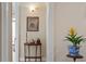 Hallway with neutral paint, wood furniture, and artwork at 1317 Colonial Club Rd, Wake Forest, NC 27587