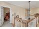 Hallway with hardwood steps and white rails leads to an upper level at 1317 Colonial Club Rd, Wake Forest, NC 27587
