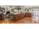 Spacious kitchen with a large island, hardwood floors, and stainless steel appliances, perfect for cooking and entertaining at 1317 Colonial Club Rd, Wake Forest, NC 27587