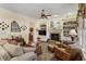 Comfortable living room with a fireplace, built-in bookshelves, and cozy seating, creating a relaxing space at 1317 Colonial Club Rd, Wake Forest, NC 27587