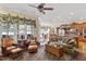 Inviting living room featuring hardwood floors, comfortable seating, and bright natural light from large windows at 1317 Colonial Club Rd, Wake Forest, NC 27587