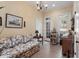 Charming sitting area featuring a floral sofa, decoratives, and plenty of natural light at 1317 Colonial Club Rd, Wake Forest, NC 27587