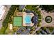 Community aerial view showcasing pool, tennis courts, playground and walking paths in a park-like setting at 1322 Regulator St, Raleigh, NC 27603
