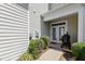 Backyard featuring a small patio with a grill and a view of the home's exterior at 1322 Regulator St, Raleigh, NC 27603