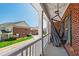 Balcony view showcasing hanging hammock and view of adjacent residences and street at 1322 Regulator St, Raleigh, NC 27603
