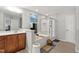The bathroom has a separate shower, tub, vanity with sink, and tile floors at 1322 Regulator St, Raleigh, NC 27603