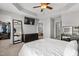 Primary bedroom with neutral walls, tray ceiling, closet and ensuite bathroom with walk-in shower at 1322 Regulator St, Raleigh, NC 27603