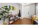 Welcoming entryway features hardwood floors, decorative shelving, and abundant natural light at 1322 Regulator St, Raleigh, NC 27603