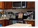 Gourmet kitchen features stainless steel appliances, a coffee maker, and attractive cabinetry at 1322 Regulator St, Raleigh, NC 27603