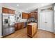 Kitchen showcases stainless steel appliances, wood cabinets, and a convenient center island at 1322 Regulator St, Raleigh, NC 27603