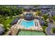 Aerial view of a community pool, tennis court, clubhouse and recreation area at 1322 Regulator St, Raleigh, NC 27603