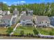 Aerial view of fenced backyards featuring patios, playgrounds, and well-maintained green lawns at 1410 Arena Ln, Fuquay Varina, NC 27526