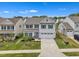 Aerial view of a two-story home, showcasing the surrounding neighborhood and meticulously maintained landscaping at 1410 Arena Ln, Fuquay Varina, NC 27526