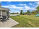 Spacious backyard featuring a patio, playful equipment, and a well-maintained lawn perfect for outdoor activities at 1410 Arena Ln, Fuquay Varina, NC 27526